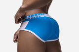 Close-up rear view of the PUMP! Match Point Brief showing blue mesh and white piping